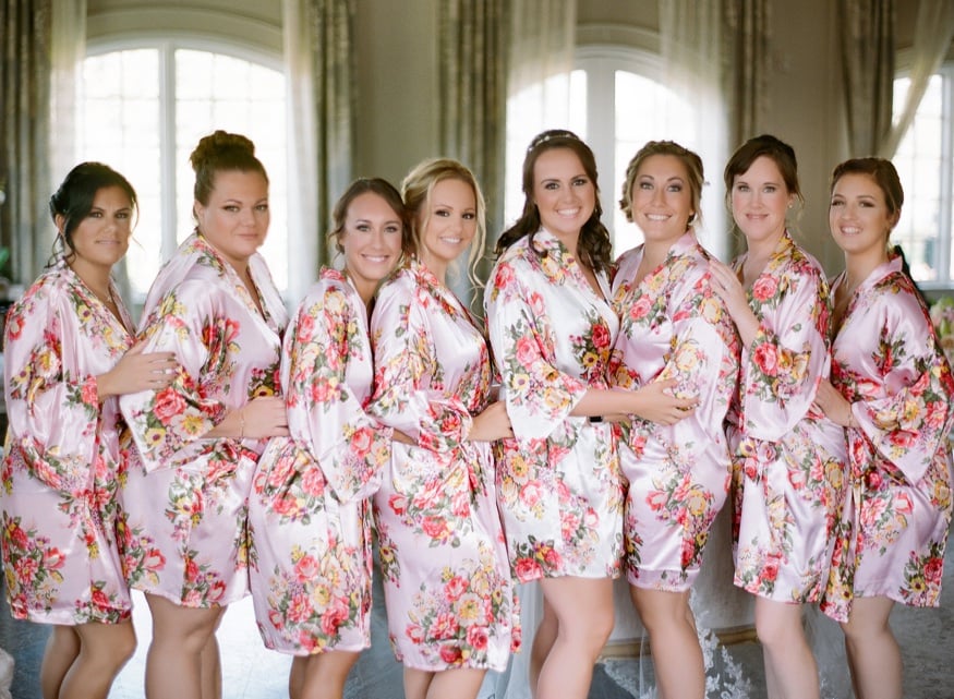Bride and bridesmaids in matching robes at Park Chateau wedding.