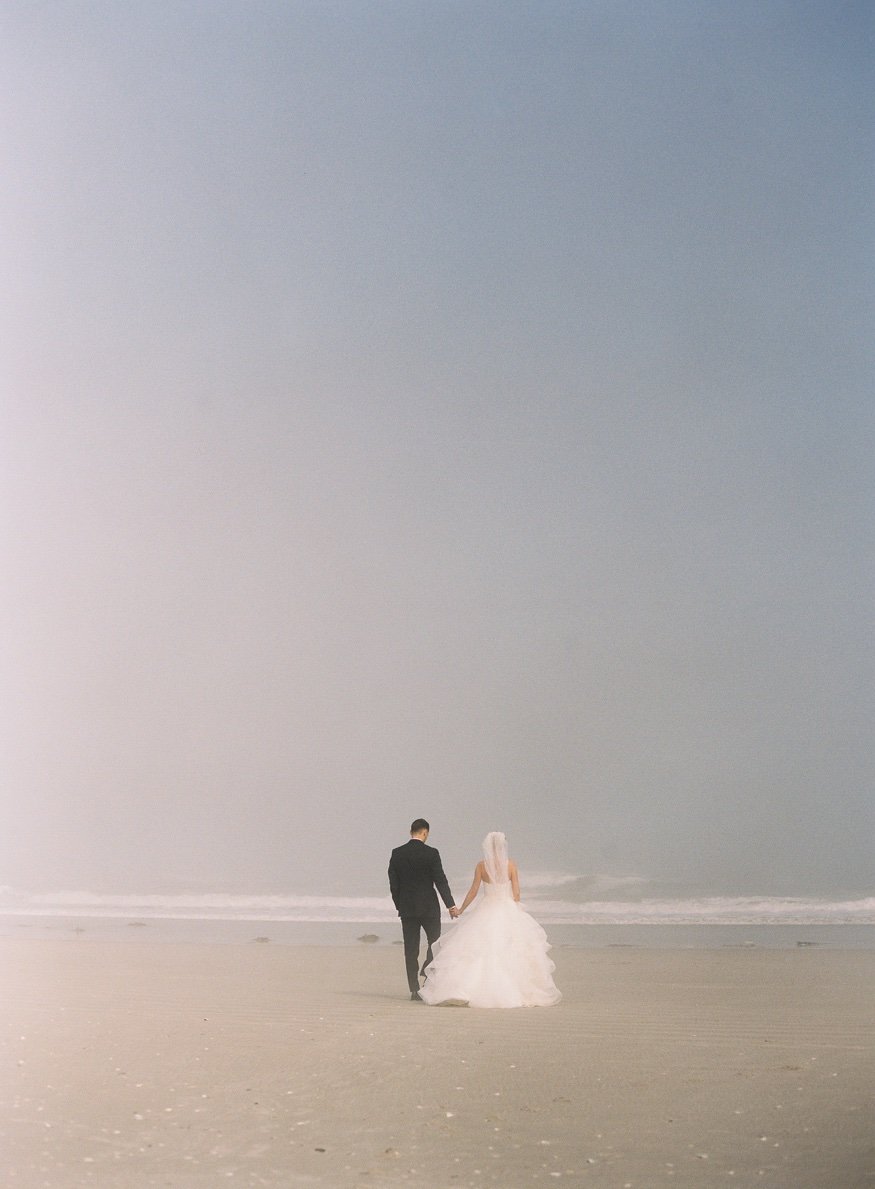 Bride and Groom portraits on the beach before Icona Avalon wedding.