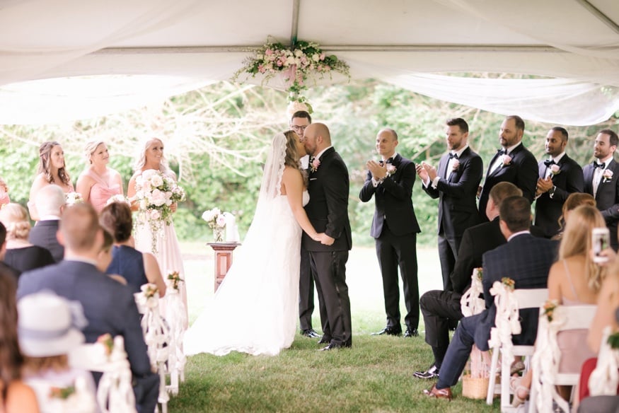 Tented ceremony at New Jersey backyard wedding.